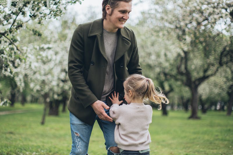Father and daughter playing together outdoors